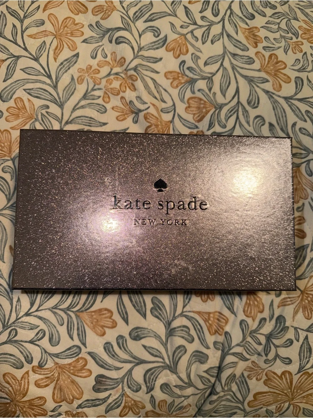 kate spade black saffiano leather flap wallet with gold plaque